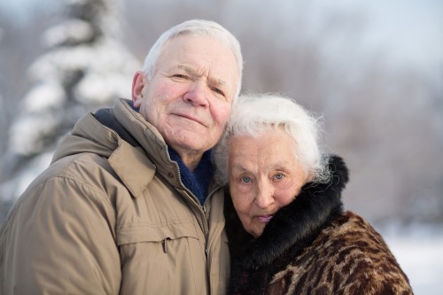 Gentle portrait of an elderly couple in winter