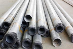 Stock of steel or iron pipes on construction