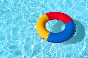 swimming pool with floatable toys in the water