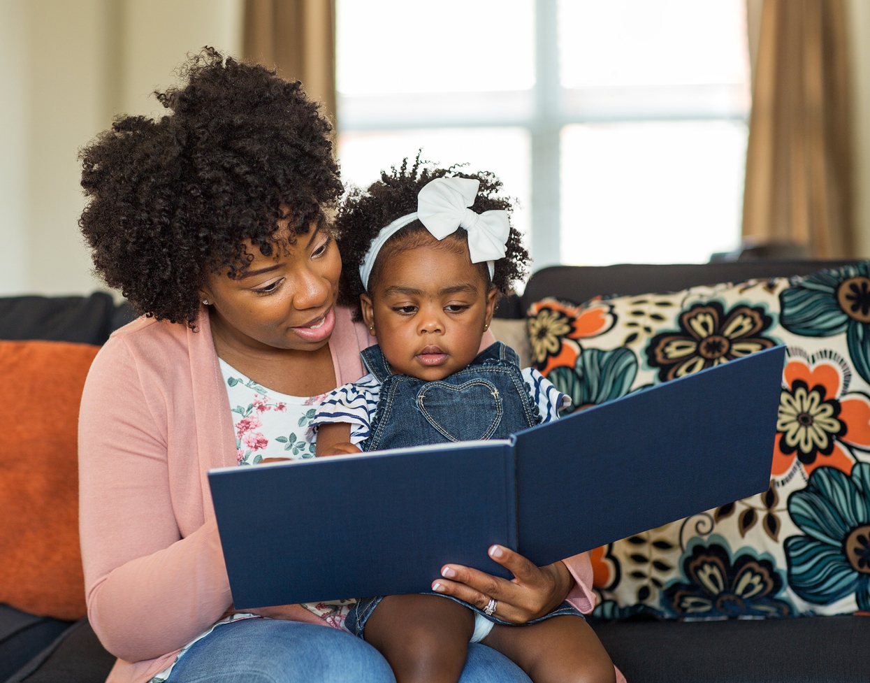 bigstock-African-American-Mother-Readin-243176584