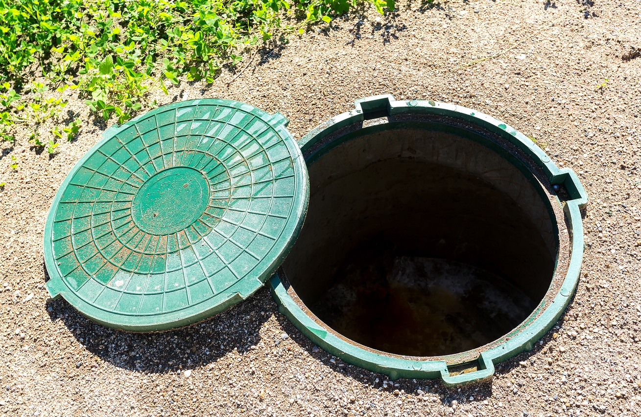 bigstock-Opened-Unsecured-Sewer-Manhole-228182509