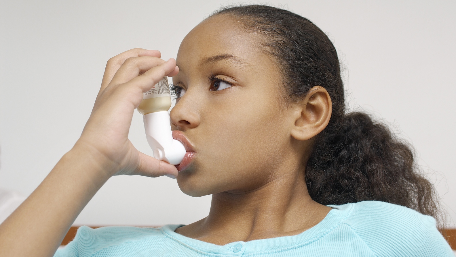 bigstock-Portrait-of-a-girl-using-asthm-41601367