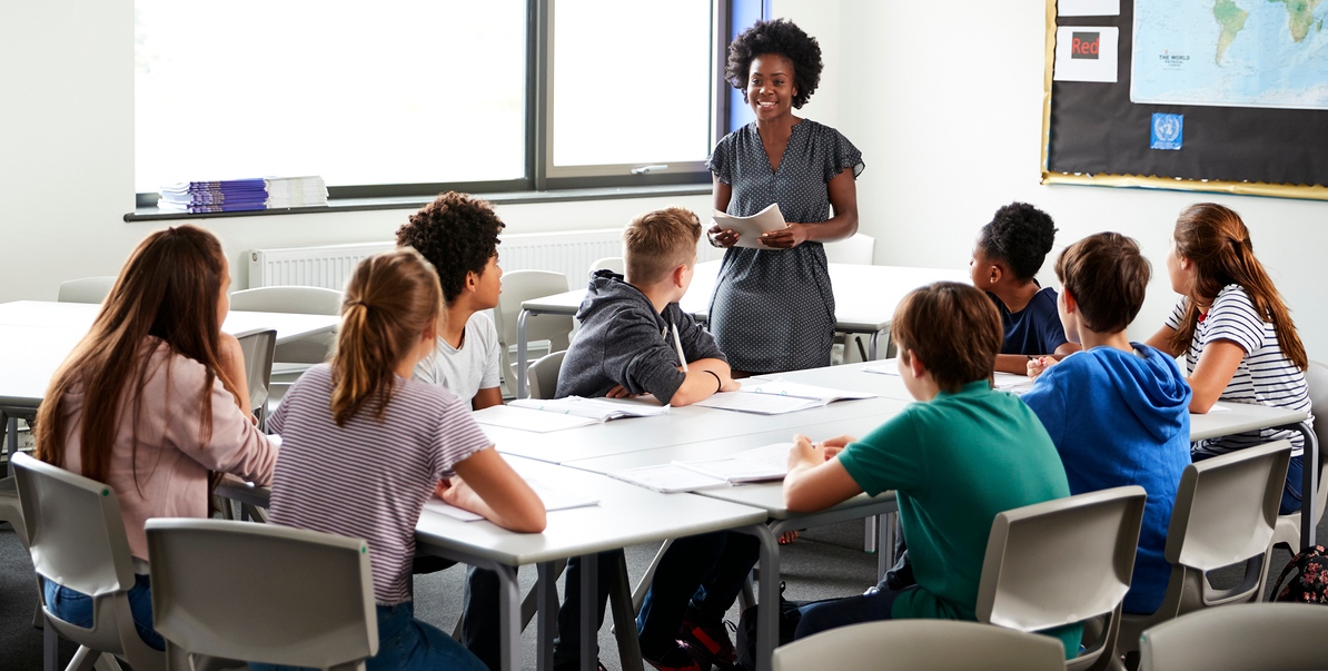 bigstock-Female-High-School-Tutor-Stand