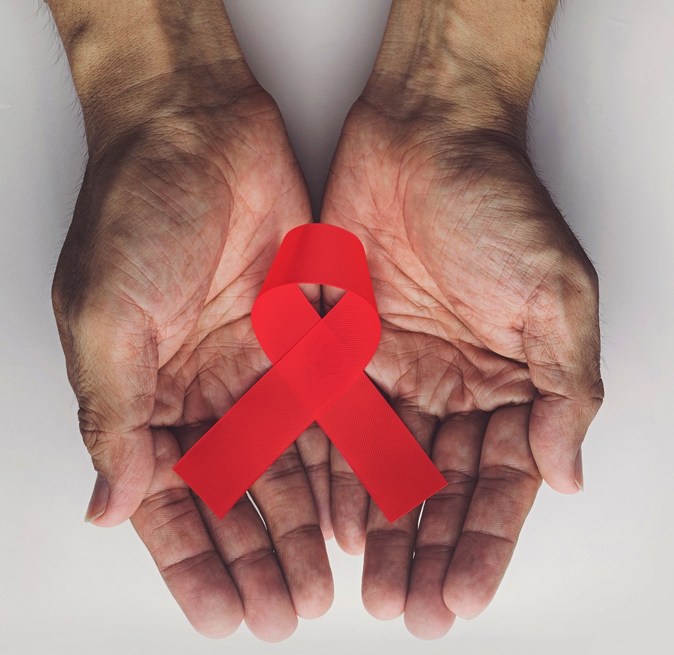 bigstock-Man-Holding-Red-Aids-Ribbon-H-301331506