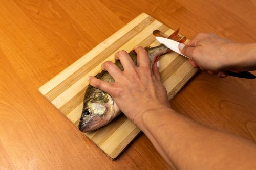 A-Woman-Is-Cleaning-Fresh-Fish